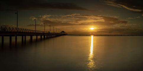 Obraz na płótnie Canvas Panoramic Pier Sunrise with Beautiful Sky