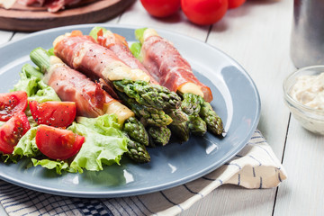 Baked prosciutto and cheese wrapped asparagus