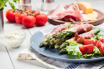 Baked prosciutto and cheese wrapped asparagus