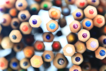 colored pencils rainbow. stacked color pencils close up shot with back light. random pattern colors placement.