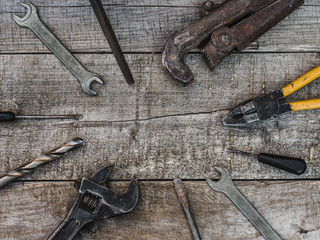 LABOR DAY. Hand tools and white protective helmet lying on the table. Top view, close-up. Preparing for the celebration. Congratulations to loved ones, family, relatives, friends and colleagues