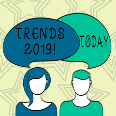 Handwriting text writing Trends 2019. Conceptual photo general direction in which something is developing or changing Blank Faces of Male and Female with Colorful Blank Speech Bubble Overlaying