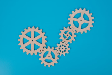 Tick gear sign on blue background. Concept of choice, ideas, business.