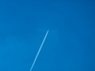 blue sky clean minimal with plane cloud trail