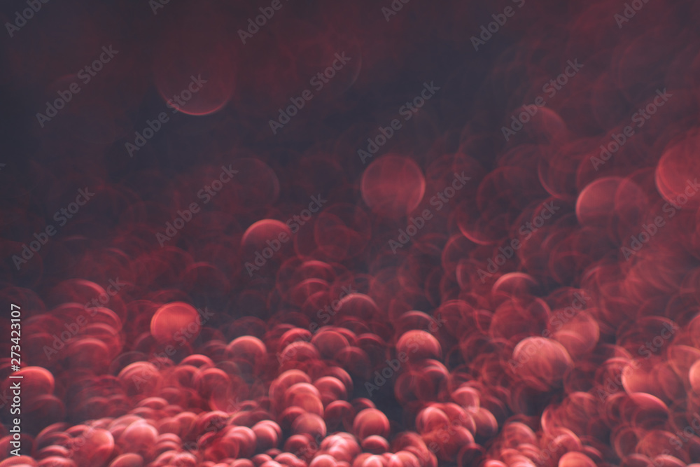 Poster beautiful red bokeh on a dark abstract background.