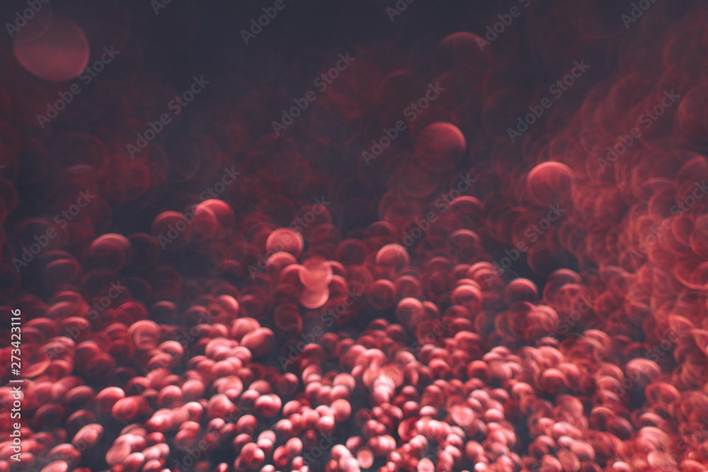 Poster Beautiful red bokeh on a dark abstract background.
