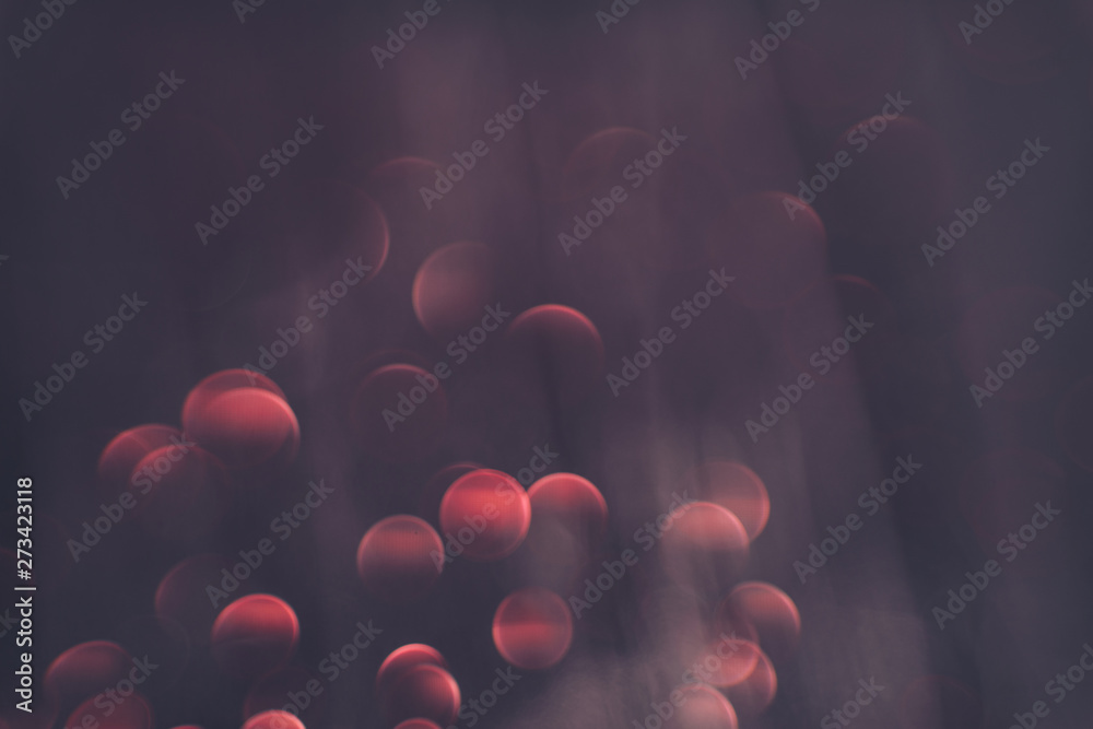 Poster Beautiful red bokeh on a dark abstract background.