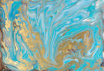 Fototapeta na wymiar Blue and gold marbling pattern. Golden marble liquid texture.