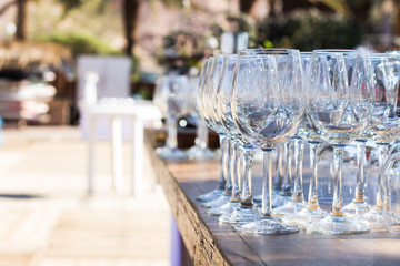 bar counter empty vine glasses outdoor exterior environment for some event, copy space 