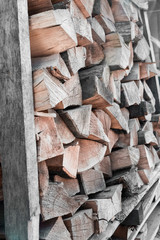 Wooden logs. Background of the chopped firewood