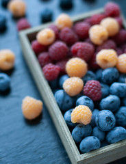 A tasty and healthy snack: raspberries and blueberries.
