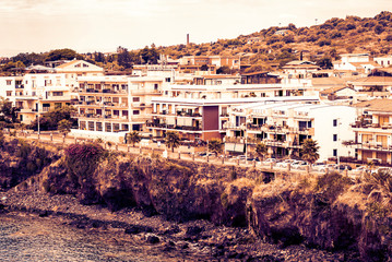 Obraz premium Sicily sunset, view of Acitrezza from the sea side of Acicastello, Catania.