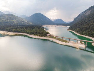 Germany, August 2018: Amazing turquoise lake Sylvenstein, upper Bavaria. Aerial view.
