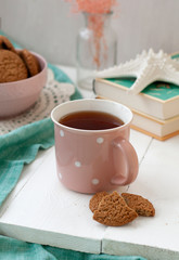 A study break: a cup of tea and a bowl of cookies.