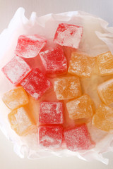Turkish delight sweets on a paper tray.