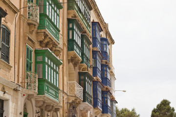 Typical maltese covered balcony and windows.
