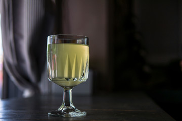 wine glass with lemonade in a summer cafe