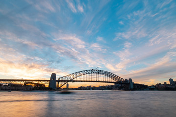 Naklejka premium Beautiful sunset sky view of Sydney Harbour Bridge.