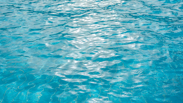 Blue water of swimming pool. Horizontal color photography.