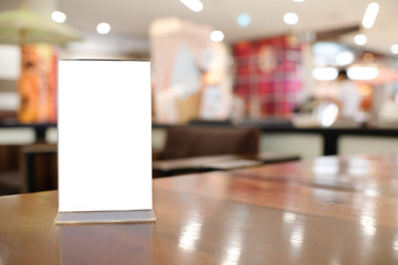 Menu frame space for text marketing promotion standing on wood table in Bar restaurant cafeใ