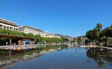 Fototapeta na wymiar Nice - French Riviera - water mirror with water jets - Promenade du Paillon