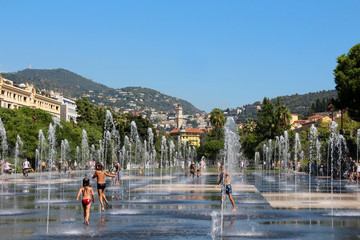 Fototapeta na wymiar Nice - French Riviera - water mirror with water jets - Promenade du Paillon