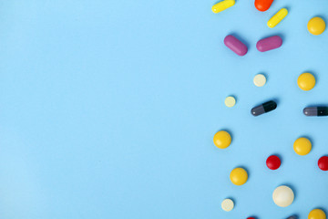 Medical background formed with different bright pills with copy space