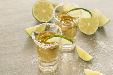 Tequila shots with sliced lime