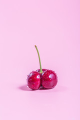 Cherries on a pink background