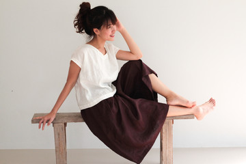 Fashion Portrait of Young  asian woman wearing natural fabric linen minimal clothing - copy space white background