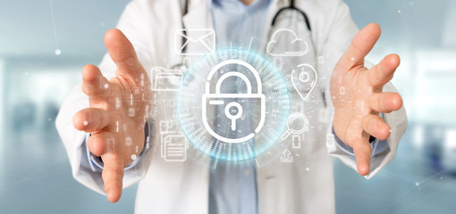 Doctor holding a Security padlock wheel icon with multimedia and social media icon 3d rendering