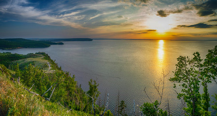 Fototapeta na wymiar Panoramic landscape with Volga river and Zhiguli reservoir during sunset form Valiant mound, hill in national park Samarskaya Luka, Russia