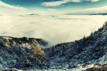 Aerial view on mountains and clouds