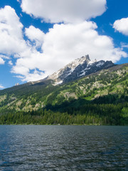 Fototapeta premium A fresh water lake in Montana with blue sky and clouds.