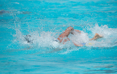 Athletes swimming on a swimming-pool