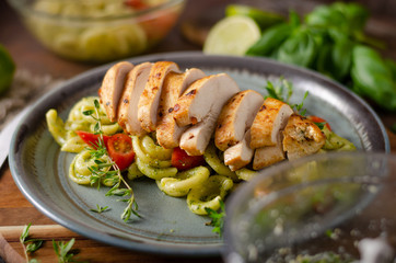 Homemade pesto pasta with grilled chicken