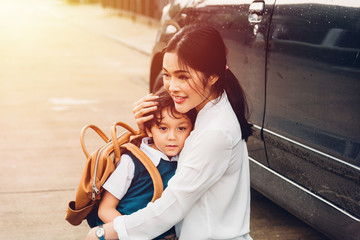Family happy mother send children kid son boy kindergarten to school