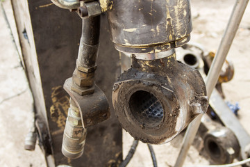 metal levers of the excavator are on the ground
