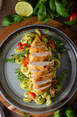 Homemade pesto pasta with grilled chicken