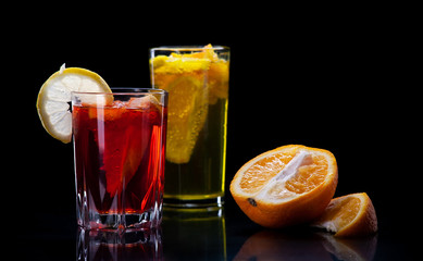 Cocktail of fresh fruit juice on a black background
