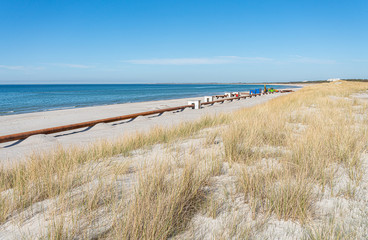 Fototapeta na wymiar Strandaufspülung - Sand Spülleitung am Strand in Dierhagen-Neuhaus an der Ostsee