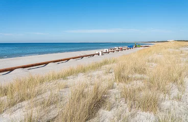 Fototapeten Strandaufspülung - Sand Spülleitung am Strand in Dierhagen-Neuhaus an der Ostsee © stylefoto24