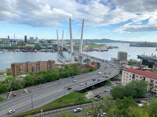 Obraz premium Cable-stayed bridge over Zolotoy Rog (Golden horn) Bay and Churkin Cape in Vladivostok in may at twilight, Russia