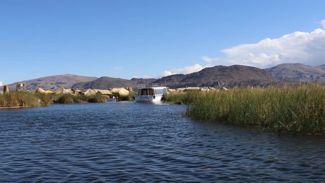 Stranded Boat on the Uros Islands hidden in reed, Lake Titicaca, Puno, Peru, South America