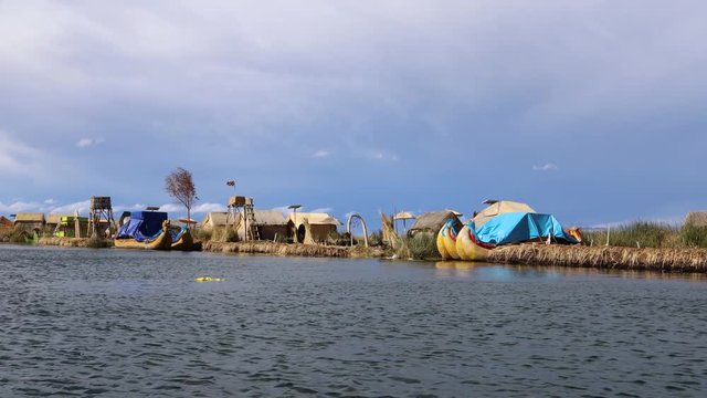 Impressions of the Uros Island on Lake Titicaca from a boat, Puno, Peru, South America