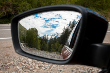 Beautiful mountains seen on the rearview mirror.