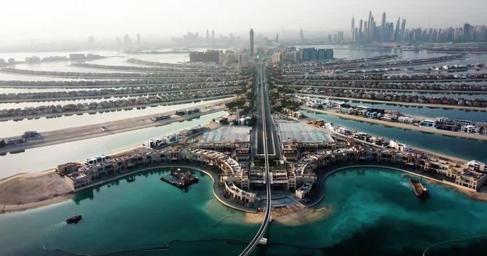The Palm island with luxury villas and hotels in Dubai aerial view