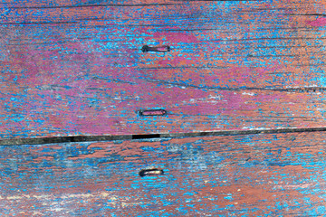 abstract colorful red blue orange background of textured wooden weathered old board
