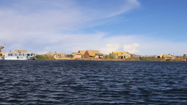 Cruising alon the Uros Island on Lake Titicaca, Puno, Peru, South America