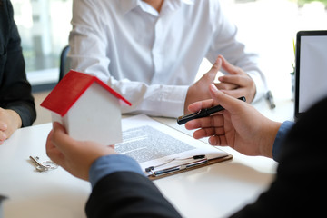 lawyer insurance broker consulting giving legal advice to couple customer about buying renting...